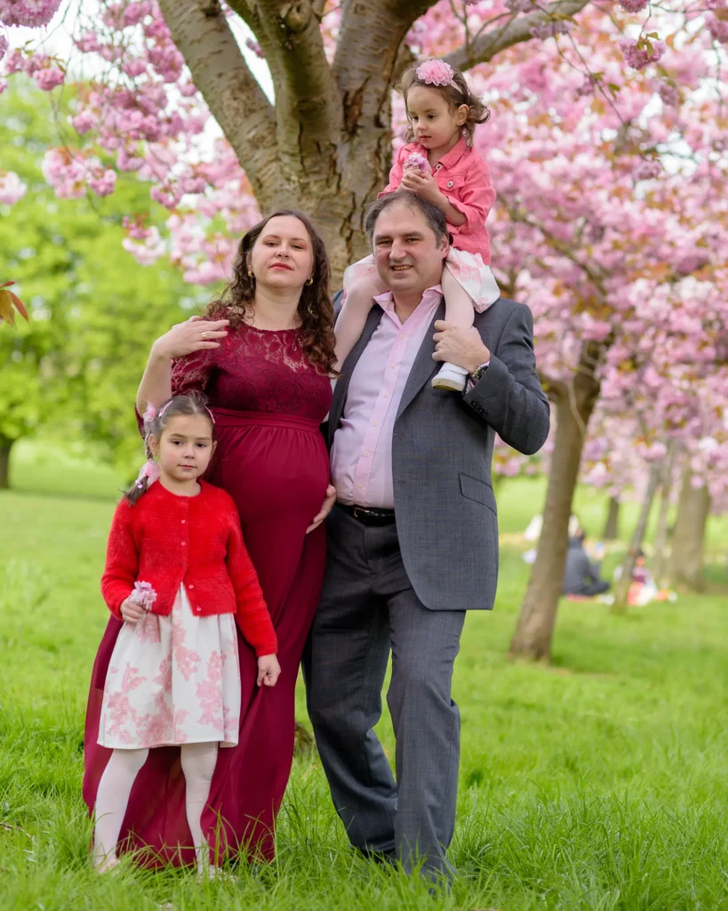 Maternity Photography in Harrogate - the whole family under a cherry treee in blossom