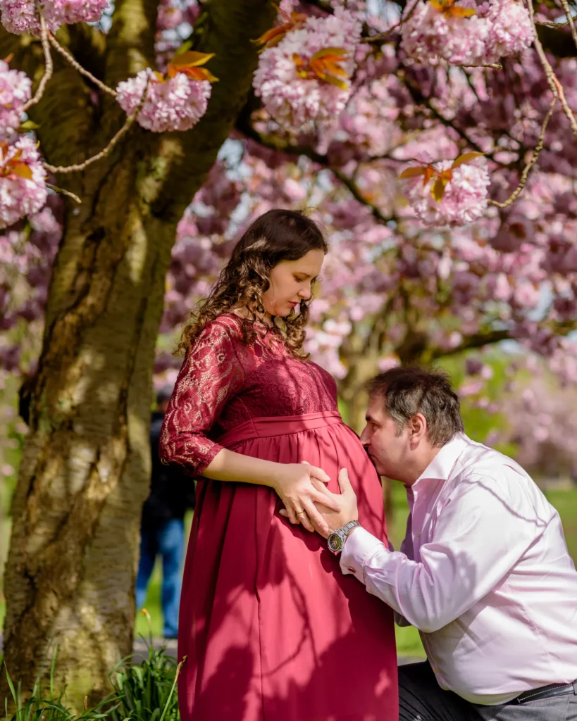 Maternity Photography in Harrogate - Iryna and her husbanc under thje cherry blossom - by Dick Lloyd Photography