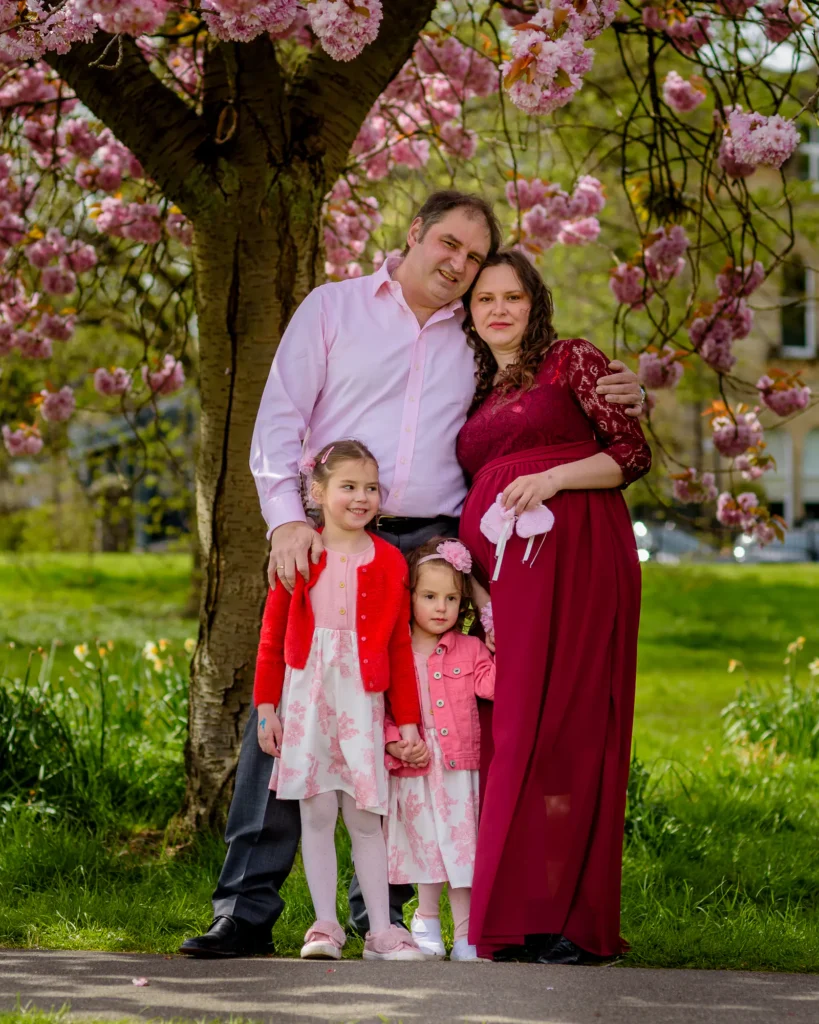 Maternity photography in Harrogate - the whole family beneath cherry blossom - by Dick Lloyd Photography