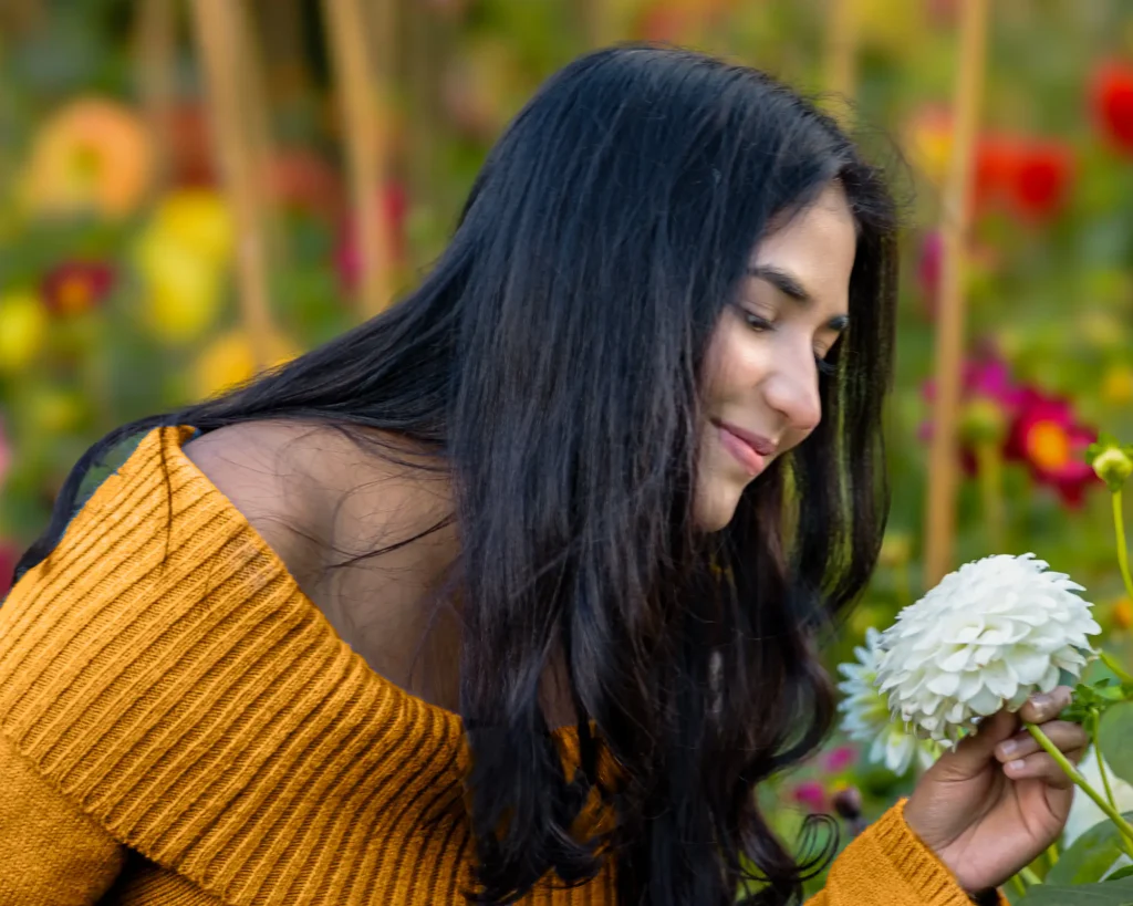 Hina-71-Edit Potrait of a young woman smelling a flower, captured by Dick Lloyd Photography