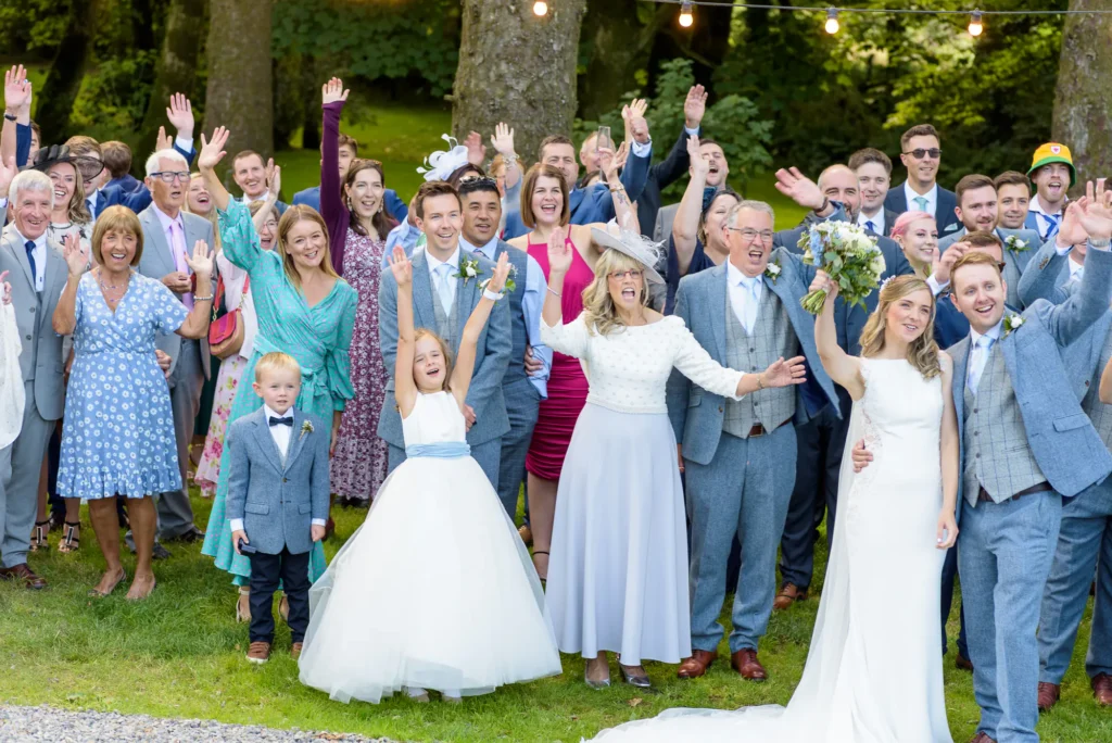 Angharad & Lewis Wedding-1228 The joyful guests cheering for the gride and groom, captured by Dick Lloyd Photography