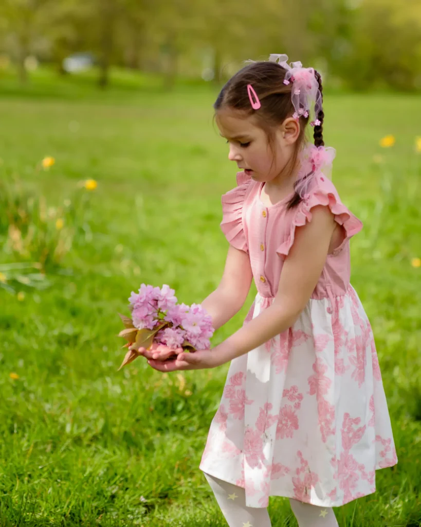 Maternity Photography in Harrogate - Anna holoding cherry blossom - by Dick Lloyd Photography