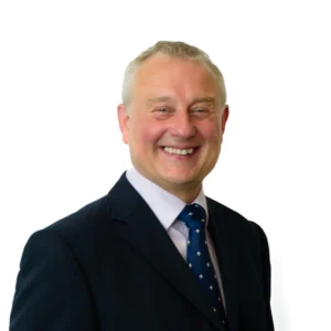 Smiling businessman in suit - headshot with white background