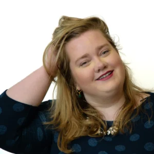 Woman posing with hand in hair - headshot with whitebackground