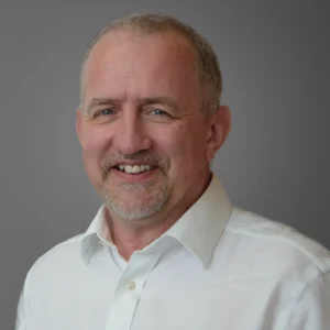 Corporate headshot in Harrogate - Businessman in white shirt with grey background